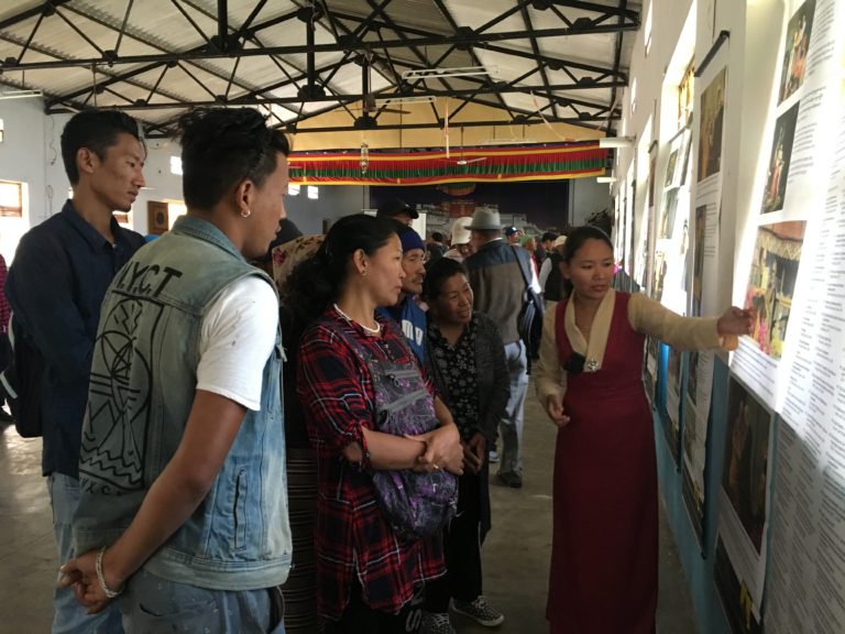Museum staff, Tenzin Youtso explaining the exhibits to visitors.