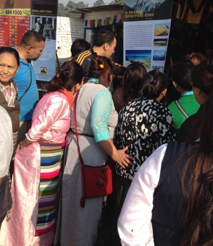 Tibet Museum staff explaining the exhibit to visitors.