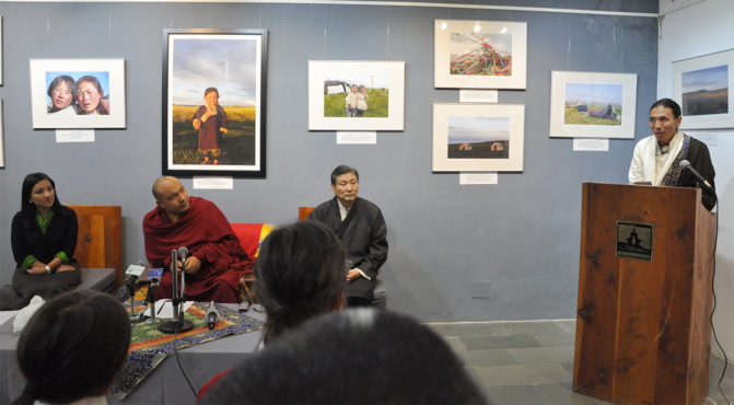 Photographer Kunchok Gyaltsen explaining th photo exhibition at the ceremony, 14 December 2016.