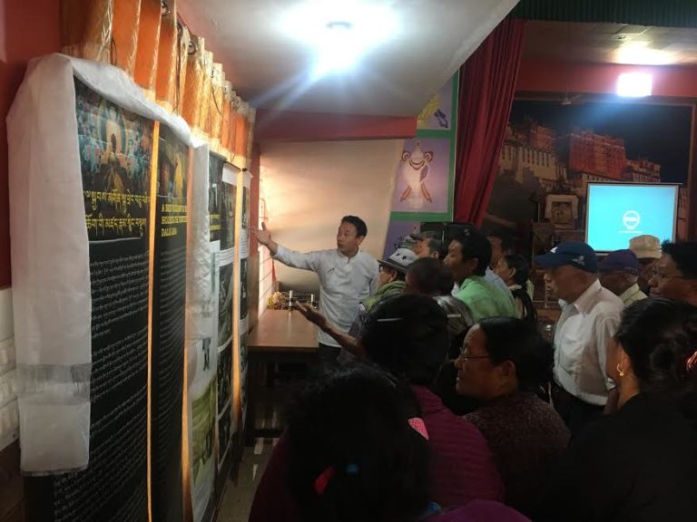 Tibet Museum staff Tenzing Ramjam, explaining the exhibits to the visitors. Photo/Tibet Museum