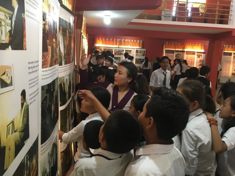 Tibet Museum staff Ms. Tenzin Ingsel explaining the exhibits to the students. Photo/Tibet Museum